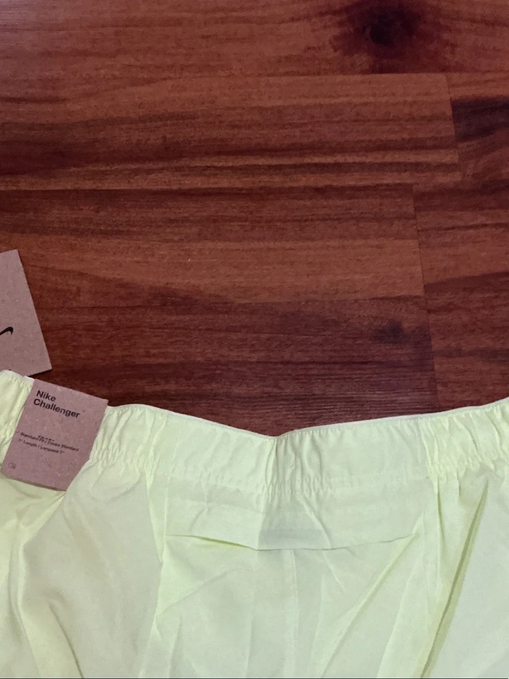 Nike men’s Pale Yellow Running Shorts with Reflective Swoosh nwt logo pockets